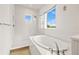 Bright bathroom featuring a soaking tub, walk-in shower, and modern fixtures, ideal for relaxation at 5810 Fieldmoor Ct, Palmetto, FL 34221