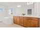 Bright bathroom with double sinks, soaking tub, walk-in shower, and ample counter space at 5810 Fieldmoor Ct, Palmetto, FL 34221