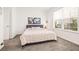 Cozy bedroom features comfortable bed, natural light, and calming decor at 5810 Fieldmoor Ct, Palmetto, FL 34221