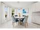 Bright breakfast nook with a round table and views from the bay windows at 5810 Fieldmoor Ct, Palmetto, FL 34221