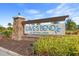 Eave's Bend at Artisan Lakes community sign with stone accents and lush landscaping at 5810 Fieldmoor Ct, Palmetto, FL 34221