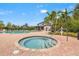 Relaxing community hot tub with a pool and clubhouse in the background at 5810 Fieldmoor Ct, Palmetto, FL 34221