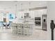 Kitchen with stainless steel appliances, a center island with bar seating, and bright open floor plan at 5810 Fieldmoor Ct, Palmetto, FL 34221