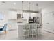 Kitchen with stainless steel appliances, a center island with bar seating, custom cabinets, and an open layout at 5810 Fieldmoor Ct, Palmetto, FL 34221
