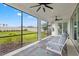 Relaxing screened lanai with comfortable seating and a view of the expansive, well-maintained backyard at 5810 Fieldmoor Ct, Palmetto, FL 34221