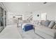 Bright, open-concept living area with modern decor and seamless flow to the kitchen at 5810 Fieldmoor Ct, Palmetto, FL 34221