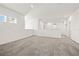 Large loft space with neutral carpet, perfect for a second Gathering room or playroom at 5810 Fieldmoor Ct, Palmetto, FL 34221