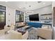 Stylish community lounge with comfortable seating, a large TV, and built-in shelving at 5810 Fieldmoor Ct, Palmetto, FL 34221