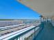 Open air balcony view overlooking meticulously lined parking, community landscaping and nearby buildings at 6020 Shore S Blvd # 1008, Gulfport, FL 33707
