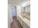 Well-maintained bathroom featuring a vanity and a view of a separate toilet area at 6020 Shore S Blvd # 1008, Gulfport, FL 33707