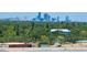Panoramic skyline view reveals lush tree canopy and distant skyscrapers, illustrating the property's convenient location at 6020 Shore S Blvd # 1008, Gulfport, FL 33707