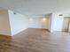 Bright, open living room featuring wood-look flooring and neutral paint for a modern aesthetic at 6020 Shore S Blvd # 1008, Gulfport, FL 33707