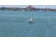 Picturesque sailboat sailing on the water with the iconic pink Don CeSar hotel in the background at 6020 Shore S Blvd # 1008, Gulfport, FL 33707