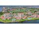 Aerial view of the coastal community featuring golf course, waterways and multiple swimming pools at 6322 Palma Del Mar S Blvd # 1107, St Petersburg, FL 33715