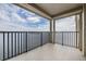 Condo balcony view showing water and city landscape in the distance at 6322 Palma Del Mar S Blvd # 1107, St Petersburg, FL 33715