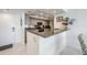 Eat-in kitchen with breakfast bar and stainless appliances at 6322 Palma Del Mar S Blvd # 1107, St Petersburg, FL 33715