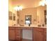 Vanity in the Primary bathroom features dual sinks, ample counter space, and wood cabinetry at 6715 Grand Estuary Trl # 203, Bradenton, FL 34212