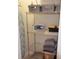 Organized closet with shelving unit storing various items, like towels and storage containers at 6715 Grand Estuary Trl # 203, Bradenton, FL 34212