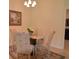 Intimate dining area featuring a round table and elegant chairs, creating a cozy atmosphere at 6715 Grand Estuary Trl # 203, Bradenton, FL 34212