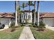 Beautiful condo with a lovely walkway and palm trees, creating a welcoming entrance at 6715 Grand Estuary Trl # 203, Bradenton, FL 34212