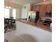 Well-appointed kitchen featuring stainless steel appliances, a breakfast bar, and a dining area at 6715 Grand Estuary Trl # 203, Bradenton, FL 34212