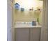 Laundry room with stacked washer and dryer, and storage shelves at 6715 Grand Estuary Trl # 203, Bradenton, FL 34212