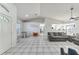 Spacious living room and dining area with tile floors and great lighting at 7330 Fairwood Ave, New Port Richey, FL 34653