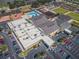 An aerial view of the community center, showcasing the pool, amenities, and ample parking at 801 Oakmont Ave, Sun City Center, FL 33573