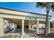 The Atrium welcomes residents with a covered entrance and easy access to golf cart parking at 801 Oakmont Ave, Sun City Center, FL 33573