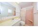 Charming bathroom with a tiled shower and classic fixtures at 801 Oakmont Ave, Sun City Center, FL 33573