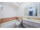 Cozy bathroom featuring a shower-tub combo and vanity at 801 Oakmont Ave, Sun City Center, FL 33573