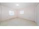 Bedroom with two windows providing ample natural light, ready for personalization at 801 Oakmont Ave, Sun City Center, FL 33573