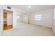 Bright bedroom with large mirrored closet doors, awaiting your personal touch at 801 Oakmont Ave, Sun City Center, FL 33573