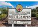 Sign for Sun City Center South Campus, a 55+ age-restricted community with a sports complex and community hall at 801 Oakmont Ave, Sun City Center, FL 33573
