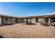 Expansive outdoor courtyard with ample seating under umbrellas and a gazebo, perfect for relaxation or gatherings at 801 Oakmont Ave, Sun City Center, FL 33573