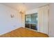 Elegant dining room with chandelier and sliding glass doors, complemented by bright natural light at 801 Oakmont Ave, Sun City Center, FL 33573