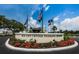 Sun City Center Veterans Memorial entrance featuring flags and landscaping at 801 Oakmont Ave, Sun City Center, FL 33573
