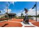 Sun City Center Community Hall features a brick entrance, flagpole, eagle monument and water feature at 801 Oakmont Ave, Sun City Center, FL 33573