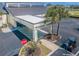 Exterior shot of the fitness center entrance with a golf cart, palm trees, and a stop sign at 801 Oakmont Ave, Sun City Center, FL 33573