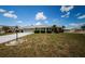 Charming single-story home featuring a well-maintained lawn and screened garage at 801 Oakmont Ave, Sun City Center, FL 33573