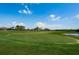 Beautifully manicured golf course with lush green fairway leading to the green, offering a premium golfing experience at 801 Oakmont Ave, Sun City Center, FL 33573