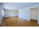 Spacious living room featuring laminate flooring and neutral walls, perfect for easy customization at 801 Oakmont Ave, Sun City Center, FL 33573