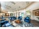Sun City Community Hall lobby features a seating area with couches, chairs, and a rug at 801 Oakmont Ave, Sun City Center, FL 33573