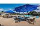 Outdoor community pool featuring ample seating and sun umbrellas, perfect for relaxation and socializing with neighbors at 801 Oakmont Ave, Sun City Center, FL 33573