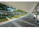 Covered shuffleboard courts surrounded by lush greenery at 801 Oakmont Ave, Sun City Center, FL 33573