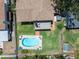 Aerial view of a home with an inviting backyard pool and patio area with seating at 8263 132Nd St, Seminole, FL 33776