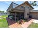The back exterior features an upper deck, a screened-in patio, and well-maintained landscaping, creating an ideal outdoor space at 8263 132Nd St, Seminole, FL 33776
