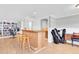 Home bar area features a hardwood bar with chairs and storage at 8263 132Nd St, Seminole, FL 33776