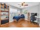 Bright bedroom with hardwood floors, a large window, and modern decor, providing a comfortable retreat at 8263 132Nd St, Seminole, FL 33776