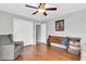 Spacious bedroom with hardwood floors, closet, and accent chair, providing a comfortable and versatile space at 8263 132Nd St, Seminole, FL 33776